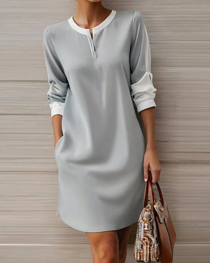 Elegantes Kleid mit Rundhals und V-Ausschnitt