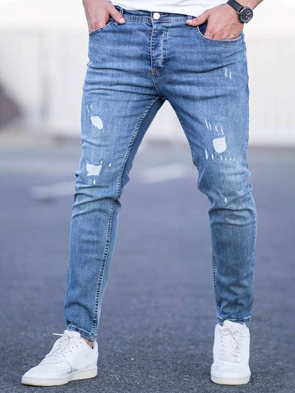 Schmale Herrenjeans Blau Zerrissen