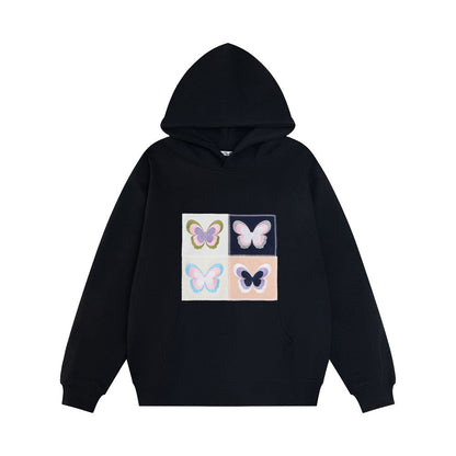 Elegante Frauenkleidung mit Stickerei Schmetterling